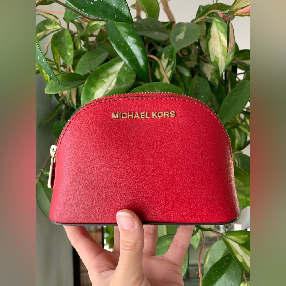 Red Michael Kors travel makeup bag